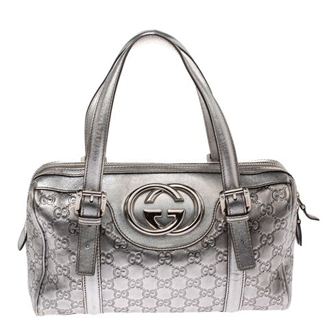 silver gucci handbag.